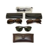 Two Pairs of Versace Tortoiseshell Coloured Framed Sunglasses, models 422A and 527, both with