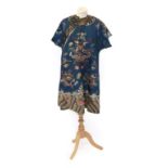 An Early 20th Century Chinese Blue Silk Robe, embroidered with dragons to the front and back, floral