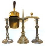 A collection of 19th century metalwares to include a pair of pewter candlesticks, a brass weight,