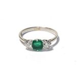 An emerald and diamond three stone ring, the asscher cut emerald flanked by round brilliant cut