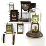A tray of timepieces and clocks including a torsion clock under glass dome, portico mantel