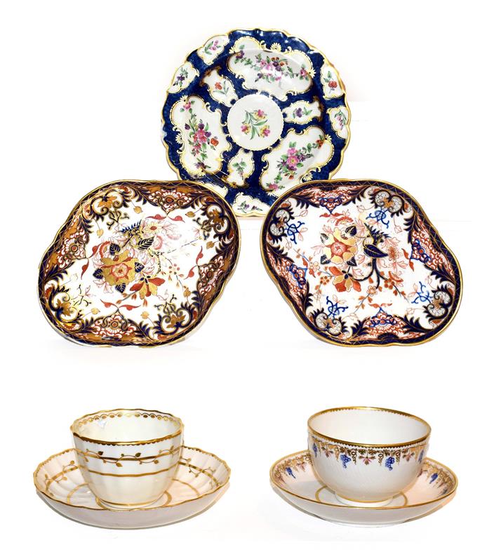 A Derby porcelain tea bowl and saucer, circa 1790, painted in blue, pink and gilt with a band of