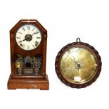 A Seth Thomas mantel clock with alarm function, together with an oak cased wheel barometer with