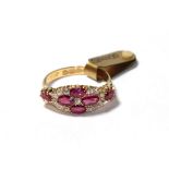 An 18 carat gold synthetic ruby and diamond cluster ring, four oval cut synthetic rubies with an old