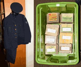 A Royal Air Force uniform with cap and RAF cap badge, together with a box of glass plate negatives