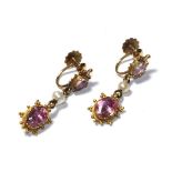 A pair of early 19th century pink tourmaline and seed pearl drop earrings, the oval cut pink