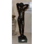 A bronze resin sculpture of a nude maiden on a marble base, 58cm high