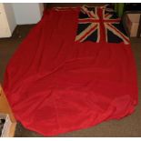 A British Merchant Navy Red Ensign, in stitched panels of linen, the hoist stencilled 4YD ENSIGN,