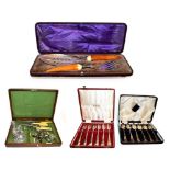 A pair of Victorian cased silver plated fish servers with stained ivory handles, together with a
