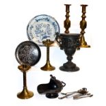 A tray of 19th century metalwares, including a Niello plate, two pairs of brass candlesticks