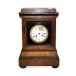 A 19th century French inlaid rosewood striking mantel clock, with gilt bezel and enamel dial