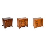 A walnut jewellery casket formed as a serpentine chest of drawers, crossbanded in mahogany,