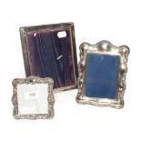An Edwardian silver faced photograph frame and two reproduction ditto (3)