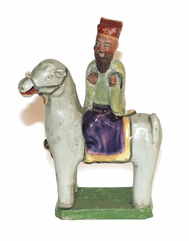 A Chinese porcelain figure of a sage, Qing dynasty, possibly 18th century, on horseback, on a
