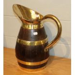 A coppered oak jug with brass mounts, 51cm