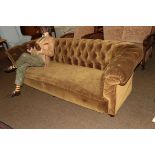 An early 20th century Chesterfield upholstered in olive velvet, 226cm by 72cm