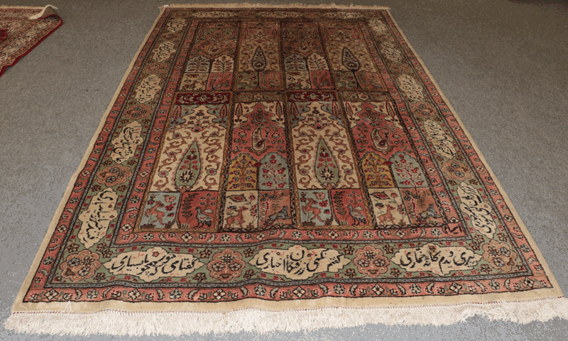 Tabriz Carpet, the field with columns of Mihrabs enclosed by cartouche borders, 306cm by 200cm
