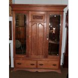 A Victorian carved oak mirror front double wardrobe (with key) 160cm by 50cm by 214cm