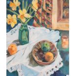 Anne Mendelow (b.1945) Still life of daffodils in a green vase and fruit on a white tablecloth