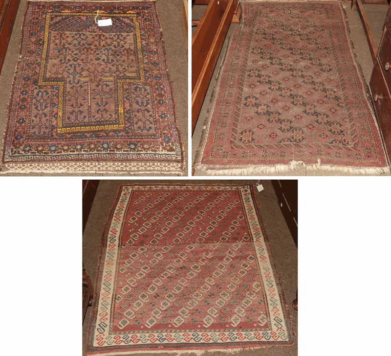 Baluch prayer rug, the field with hooked devices beneath the mihrab enclosed by stellar motif