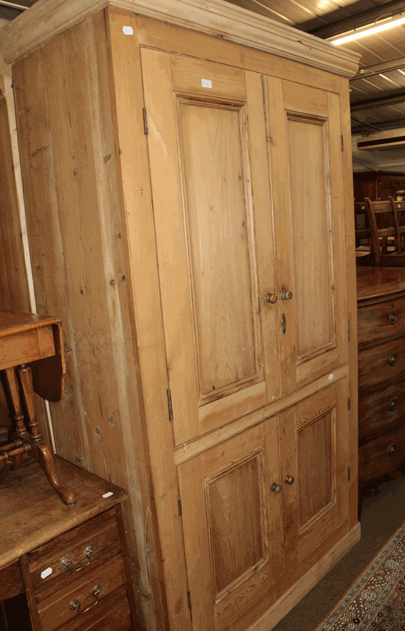 A Victorian pine linen cupboard, 118cm by 55cm by 214cm