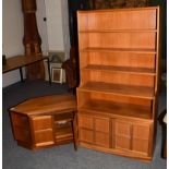 A 1970's Nathan teak open bookcase, 84cm by 34cm by 158cm and matching low cabinet, 99cm by 49cm