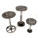 A graduated set of three Steampunk Industrial metal tripod tables, each constructed using various