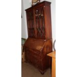 A George III mahogany bureau bookcase, the upper section with glazed astragal doors enclosing two