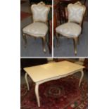 A French style painted extending dining table with additional leaf, raised on scroll supports,
