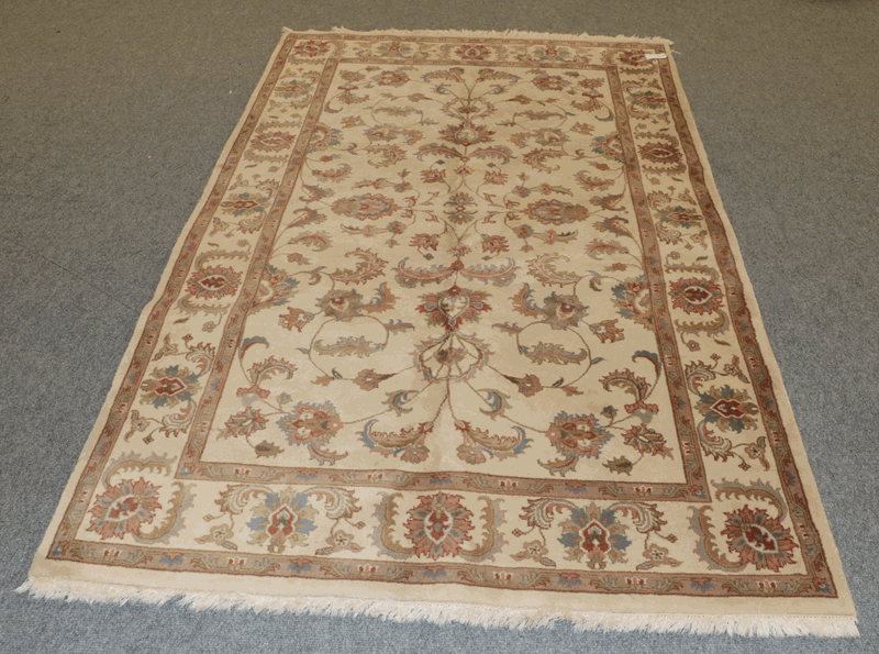 Agra design Rug, the ivory field of vines enclosed by similar borders, 240cm by 152cm