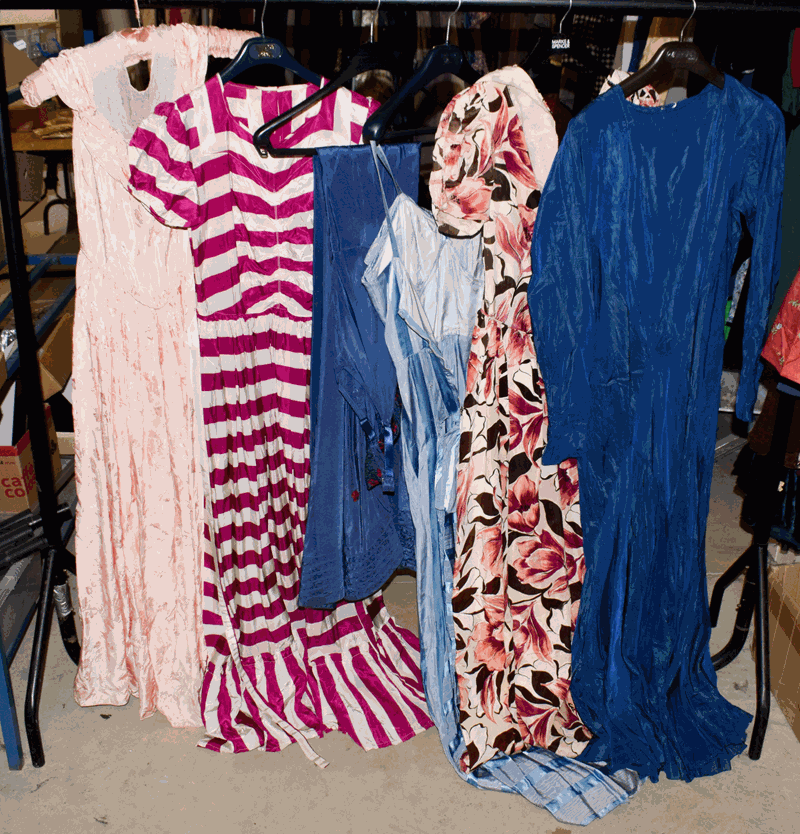 Seven circa 1930s/40s full length evening dresses, comprising a pink silk brocade dress with