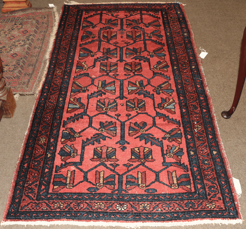 Hamadan rug, the coral pink angular lattice field of stylized plants enclosed by narrow borders