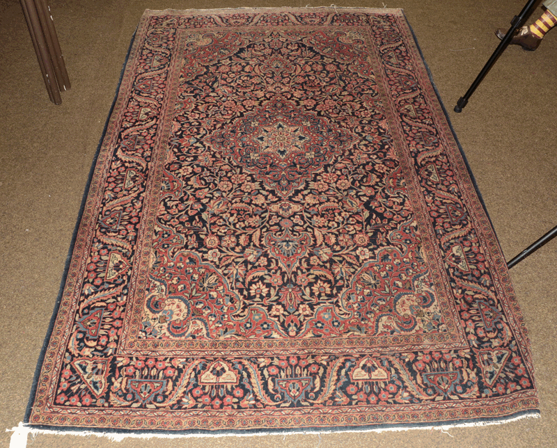 Kashan rug, circa 1930, the indigo floral field with central diamond medallion framed by