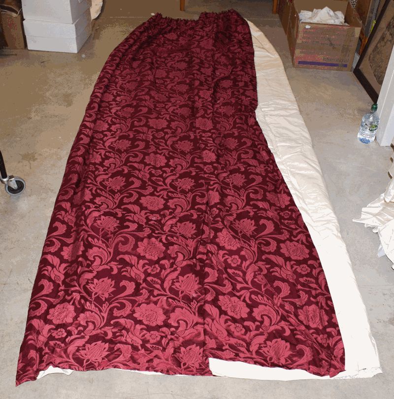 Pair of red brocade modern curtains, lined and interlined . Appears in very good condition.