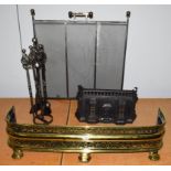 A Victorian pierced brass fire fender, a spark guard, a fireside companion set and a cottage