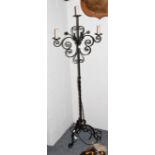 A wrought metal three light standard lamps formed as a candle stand, 161cm high