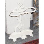 A white painted cast iron two-division stick stand, cast with grapes and vines, 62cm high