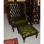 A Thomas Lloyd green leather Chesterfield wingback armchair with deep buttoned footstool (2)