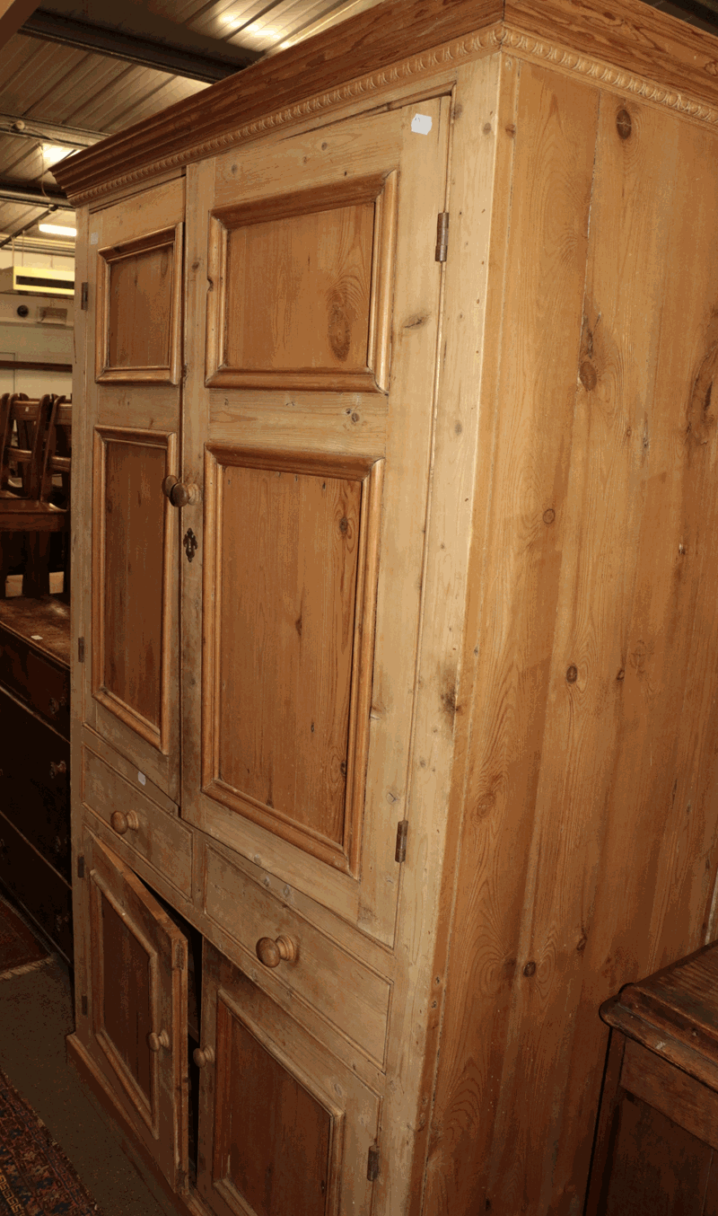A Victorian pine linen cupboard, 118cm by 55cm by 200cm