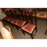 A set of six 19th century mahogany yoke-backed dining chairs with drop in seats