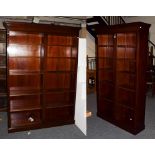 Two reproduction mahogany open bookcases with adjustable shelves, the largest 147cm by 30cm by 214cm