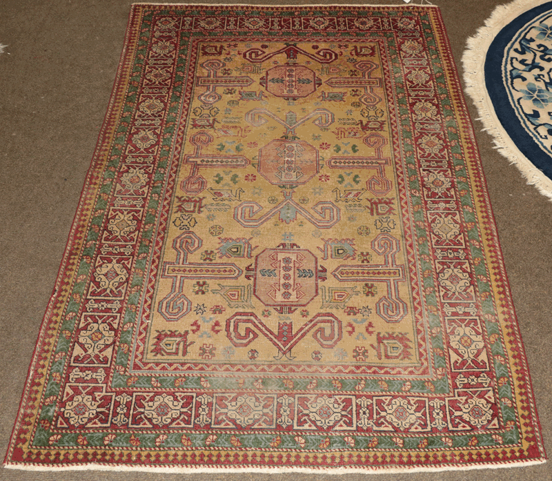 Perepedil design rug, the lemon field with rams horn and zoomorphic motifs enclosed by kufic borders