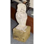 Garden statue of an owl on a grit stone base, 70cm high