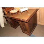 An early 20th century oak pedestal desk with leather insert, 141cm by 80cm by 79cm