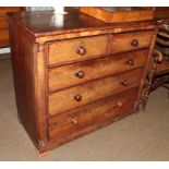 A Victorian mahogany chest of drawers, two short over three long, cross banded on turned column