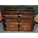 An early 20th century wood and metal bound American steamer trunk, 87cm by 53cm by 57cm