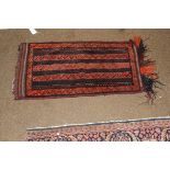 A Turkish Kilim saddlebag, decorated with alternating columns of red and claret ground, 52cm by
