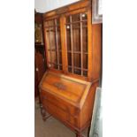 A 1920s oak bureau bookcase, 90cm by 44cm by 194cm