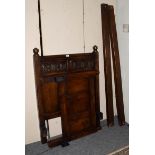 An 18th century style carved oak single bedstead, 93cm wide by 120cm high