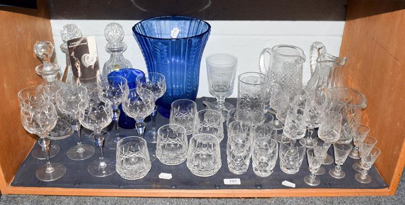 A quantity of cut lead crystal including a part suite of Waterford drinking glasses, decanters and